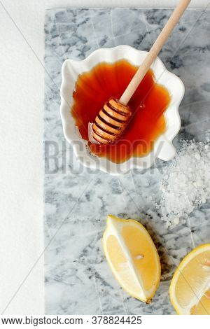 Natural Ingredients For Homemade Body Salt Scrub. Honey, Sea Salt And Lemon. Skincare Organic, Self-