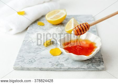 Facial Treatment Preparation. Simple Homemade Facial Mask And Spa Products, Honey, Lemon On Marble P
