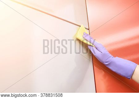 Hand In Protective Glove Clean Kitchen Cabinet. House Cleaning With Rag. Washing And Disinfect Rasta