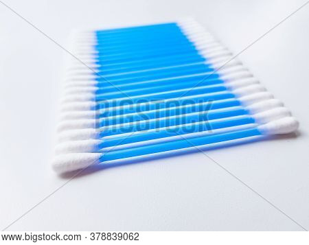 Ear Sticks With Blue Plastic On A White Background. Personal Hygiene And Self-care. Cosmetology And 