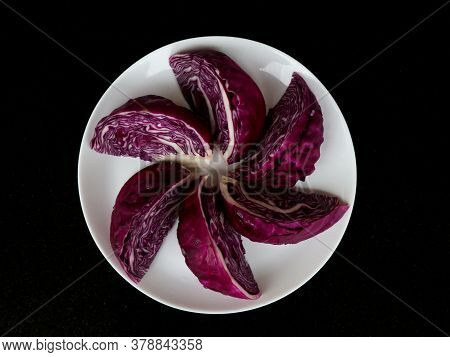 Fresh Raw And Organic Cut Violet Color Cabbage In White Plate As Texture, Background