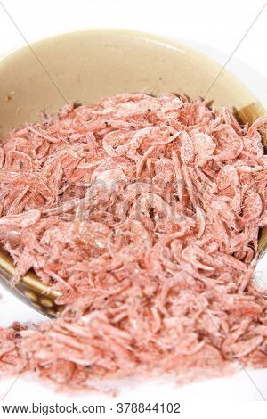 Red dried shrimp Is a food preservation Of Asian people on a white background. Use the flash for sharpness in the studio.