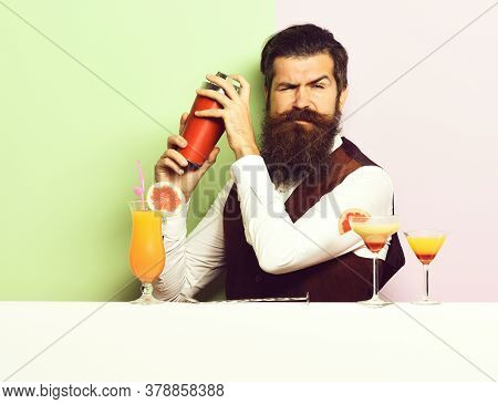 Funny Handsome Bearded Barman On Purple Green Studio Background