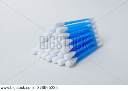 Ear Sticks With Blue Plastic On A White Background. Personal Hygiene And Self-care. Cosmetology And 