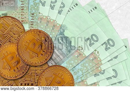 20 Ukrainian Hryvnias Bills And Golden Bitcoins. Cryptocurrency Investment Concept. Crypto Mining Or