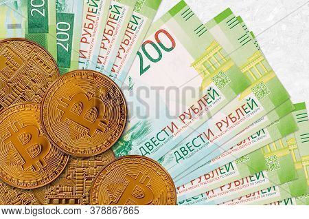 200 Russian Rubles Bills And Golden Bitcoins. Cryptocurrency Investment Concept. Crypto Mining Or Tr
