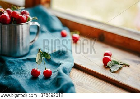 Ripe Cherries In A Mug. Good Morning Concept Cottagecore Aesthetics. Rustic, Vintage Style. Selectiv
