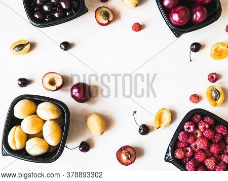 Fresh Berries Are Packed In Trays. Vitamin-rich Fruits Are Packaged In Boxes. Variety Of Fruits For 