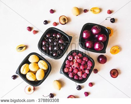 Fresh Berries Are Packed In Trays. Vitamin-rich Fruits Are Packaged In Boxes. Variety Of Fruits For 