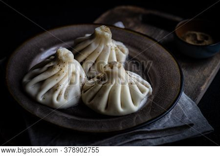 Traditional Georgian Khinkali Dish On Stone Background