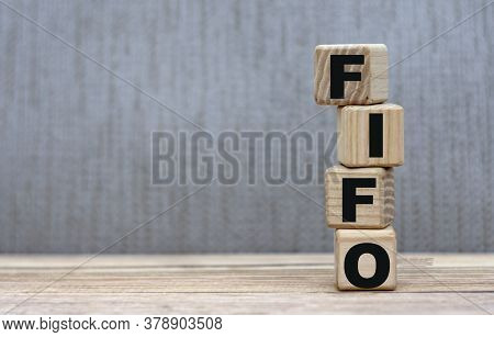 Concept Of The Word Fifo (first In, First Out) - On Cubes On A Gray Background