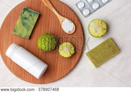 Natural Cosmetics From Osage Orange Fruit, Soap, Cream And Tablets On A Light Background, Copy Space