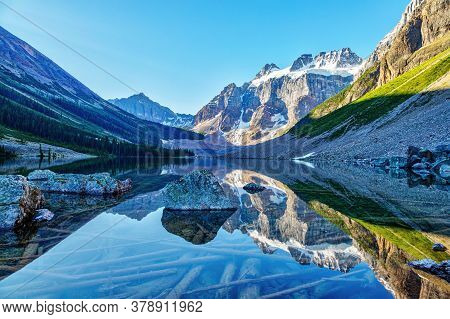 Beautiful Glacier-covered Mount Quadra Reflecting Off Upper Consolation Lake Near Moraine Lake In Ba