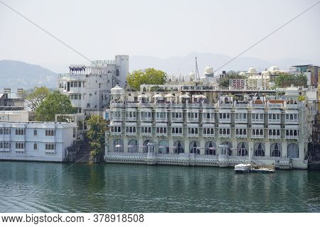 Multi-family Residential Buildings Next To The Lake. They Provide The Residents Of The Flats With Di