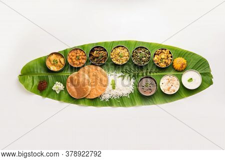 South Indian style Lunch Or Dinner Meal Or Food Served With A Selection Of Recipes Over Banana Leaf