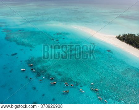 Aerial View Of Mnemba Atoll In Zanzibar - The Famous Spot For Snorkeling And Boat Tour