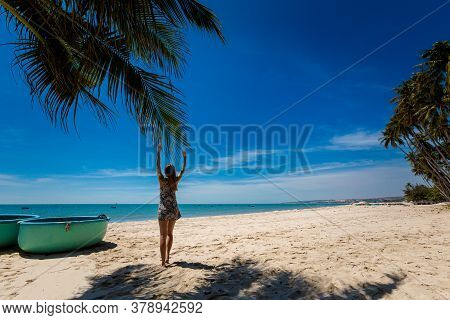 Young Sexi Woman On Palm In Vietnam