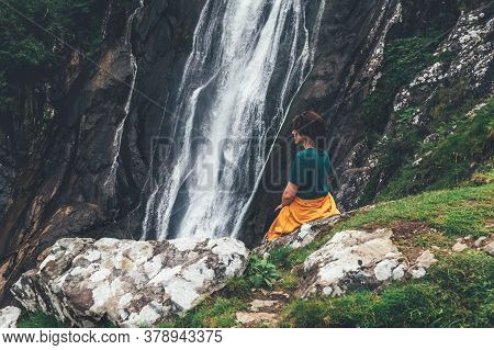 Young Woman At Aber Falls Or In Welsh Rhaeadr Fawr Is Waterfall Located About Two Miles South Of The