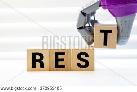 Rest Word From Wooden Blocks On Desk