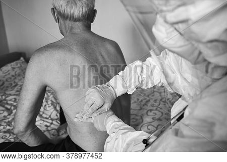 Black And White Snapshot Of A Doctors Examination At Patients Home During Quarantine 2020. Cropped D