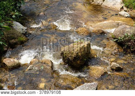 Mountain River Flowing Over The Stones. Wildlife Beauty In Malaysia