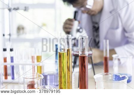 Blurred Soft Images Of The Scientist Doing Chemical Experiment In Order To Develop Products With Qua
