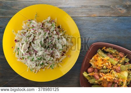 Salad Daikon, Onions And Dill On Blue Grey Wooden Background. Salad On Yellow Plate With Vegetarian 