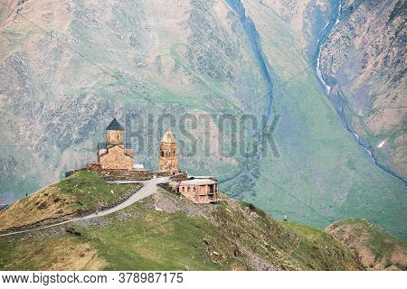 Stephantsminda, Georgia. Gergeti Trinity Church Or Tsminda Sameba - Holy Trinity Church Near Village