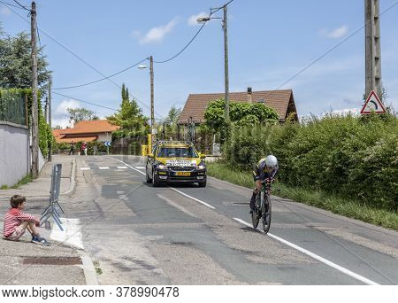 Bourgoin-jallieu, France - 07, May, 2017: A Kid On The Roadside Is Looking Tothe Dutch Cyclist Antwa