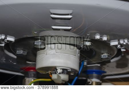 Detailed Shot Of The Bottom Of The Water Heater. Leaking Outboard Home Boiler. Repair And Maintenanc