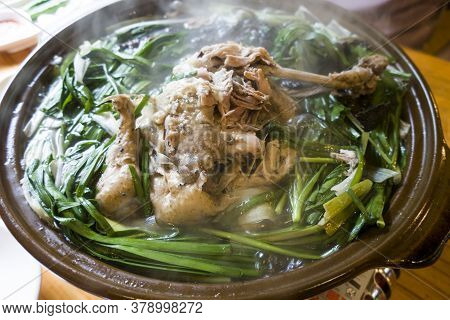 Korean Chicken Soup With Mushrooms And Chives.