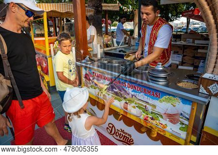 Kas, Turkey - June 7, 2023 : Seller Of Dondurma Or Turkish Ice Cream Doing A Spectacular Show To The