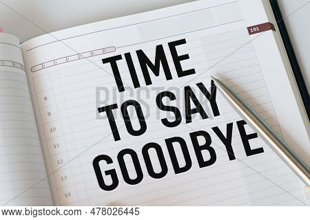 Time To Say Goodbye Text Written On Notebook Page And Pen.