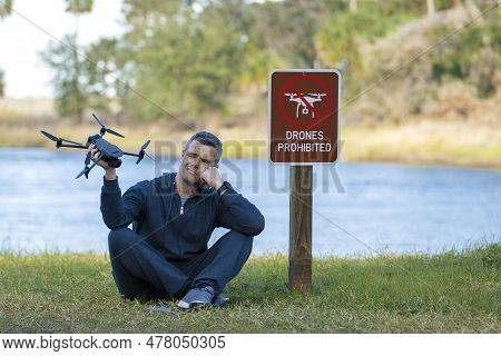 Man Is Sad That He Is Not Allowed To Fly His Quadcopter State Park No Drone Area. Operator Is Unauth
