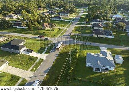 Top View Of Standard American Yellow School Bus Picking Up Kids At Rural Town Street Stop For Their 