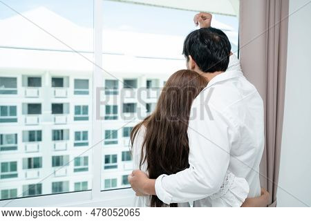 Happy Young Couple Relaxing At Home In The Morning.