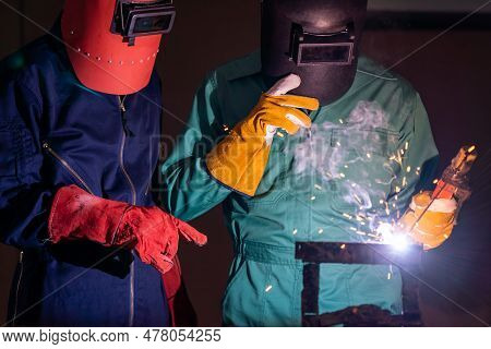 Metal Welding Steel Works Using Electric Arc Welding Machine To Weld Steel At Factory. Metalwork Man