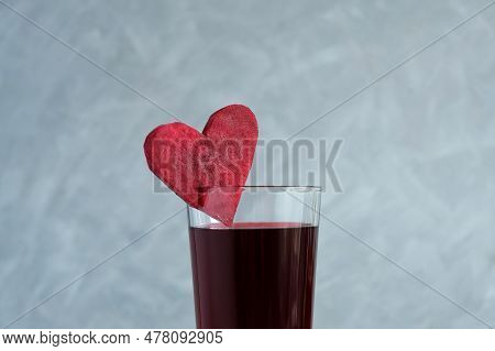 Beetroot Juice, Close-up. Glass Of Red Beverage Decorated Slice Of Beet Heart Shaped. Salgam.