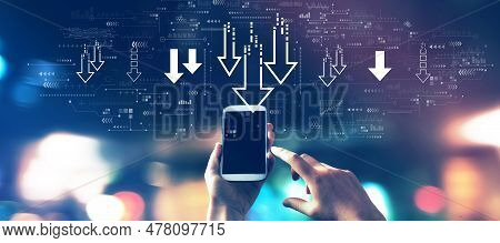 Descending Arrows With A Smartphone In Blurred City Lights At Night