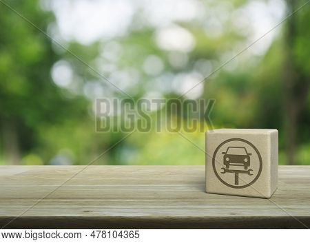 Service Fix Car With Wrench Tool Icon On Wood Block Cube On Wooden Table Over Blur Green Tree In Par