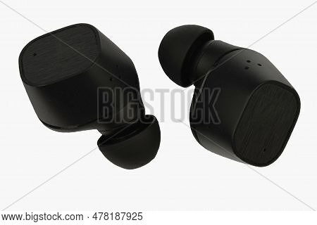 Wireless Stereo Earbuds. Black Wireless Earphones. Earbuds Or Headphones Isolated On White Backgroun
