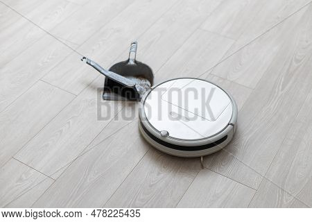 Robotic Vacuum Cleaner On Laminate Wood Floor Smart Cleaning Technology
