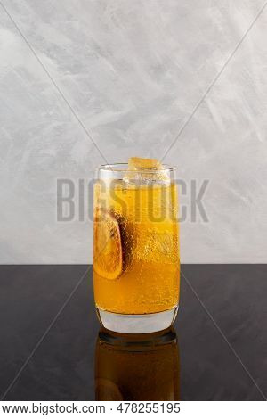 Yuzu And Passion Fruit Drink Cocktail. Fruit Lemonade Based Orange Juice. Refreshing Sparkling Iced 