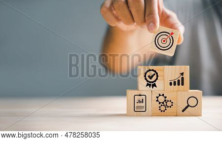 Wood Block Stacking By Hand, Showcasing The Essence Of Business Strategy And Action Plan. Copy Space