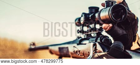 Hunting Period. Male With A Gun. Hunter With Hunting Gun And Hunting Form To Hunt. Hunter Is Aiming.