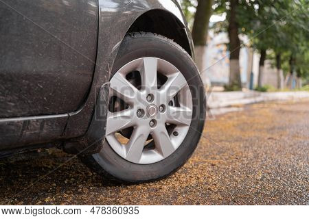 Close Up Of A Black Car Tire Park On The Road. Car Wheels, Low Profile Tires On Aluminum Rims