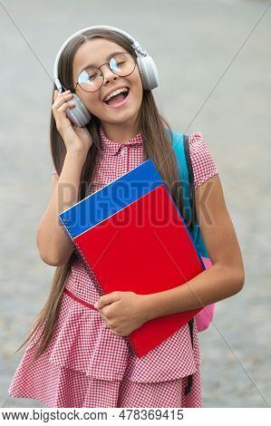 Teen Girl Has Estudy Hold Workbooks Outdoor. Photo Of Teen Girl Has Estudy During Holidays.