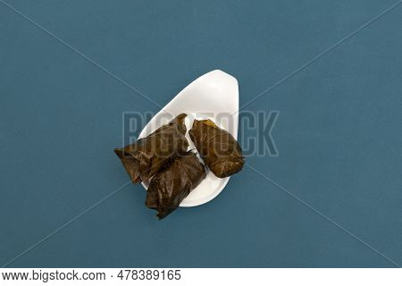Dolma In White Sauce, Top View. Stuffed Grape Leaves With Beef Or Lamb Meat. Dolma Or Sarma. Mediter