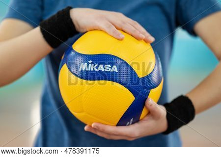 Chernihiv, Ukraine - March 09, 2023: Girl Volleyball Player Holding New Mikasa Ball In Hands. Beauti
