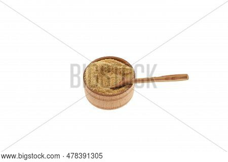 Hulbah Powder Or Fenugreek Flour In Wooden Bowl On White Background, Selective Focus. Herbal Nutriti